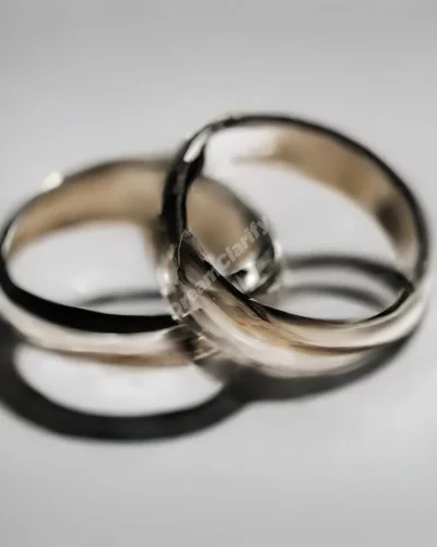 Wedding rings breaking apart, symbolizing separation in divorce dreams.